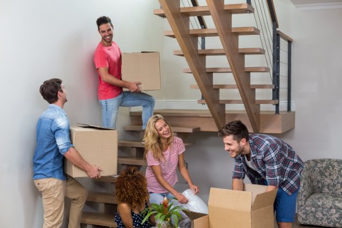 Removal team planning a house move in Bloomsbury with boxes and furniture