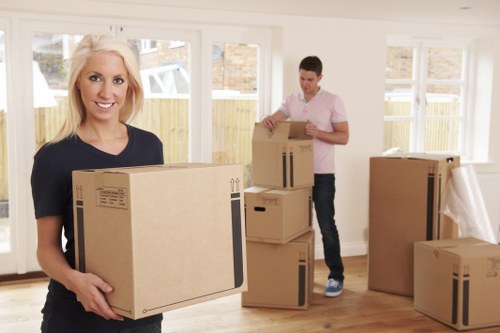 Professional movers loading household items for a central London relocation